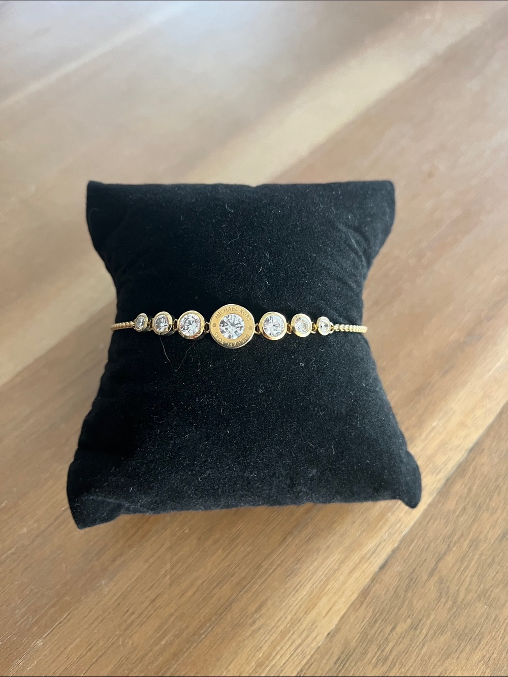 Michael Kors gold finish cubic zirconia pull bracelet